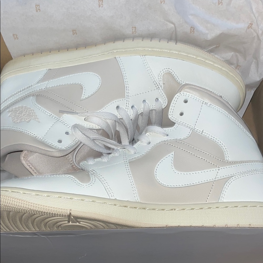 Jordan White and Cream Sneakers with Classic High-Top Design